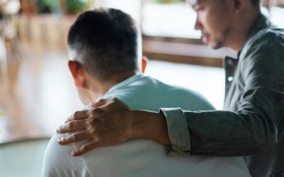 Photo of a man with his hand on the shoulder of another man to illustrate the article How to Confess Your Sins to One Another